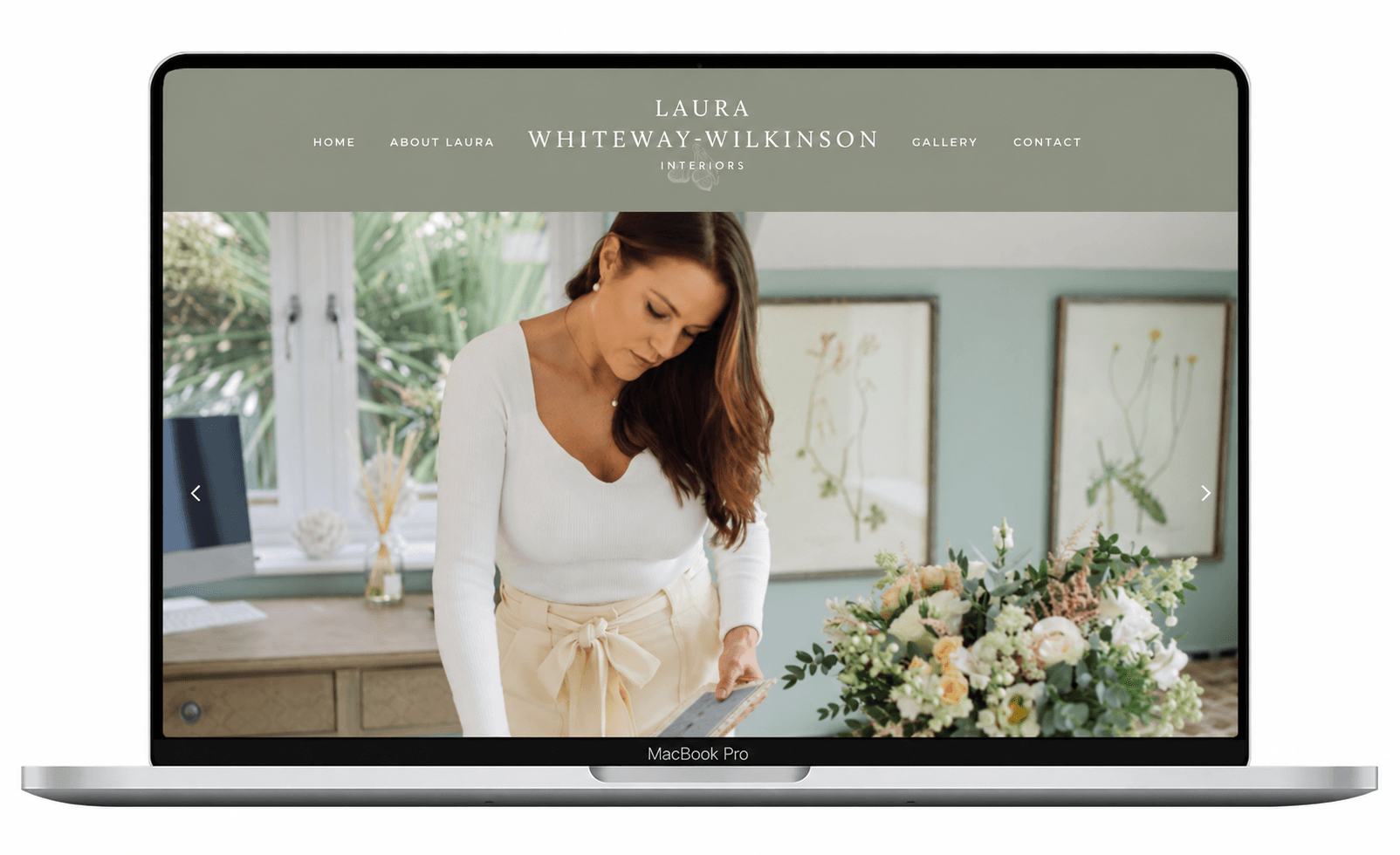 Laura Whiteway-Wilkinson Interiors website in a laptop frame